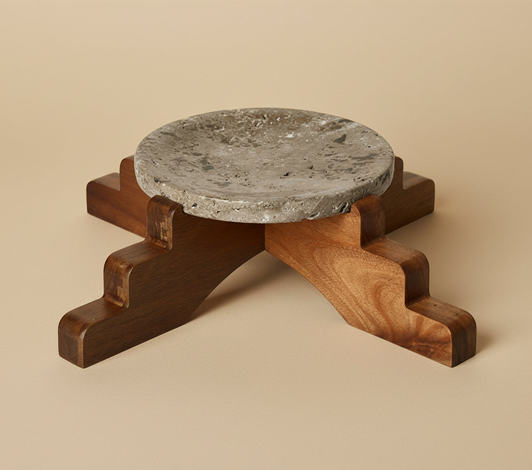 Wooden stool with a stone top on a white background, featuring the Vanik Living brand.