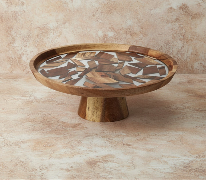 Wooden cake stand with mosaic top on a white background, featuring the brand 'Vanik Living'.