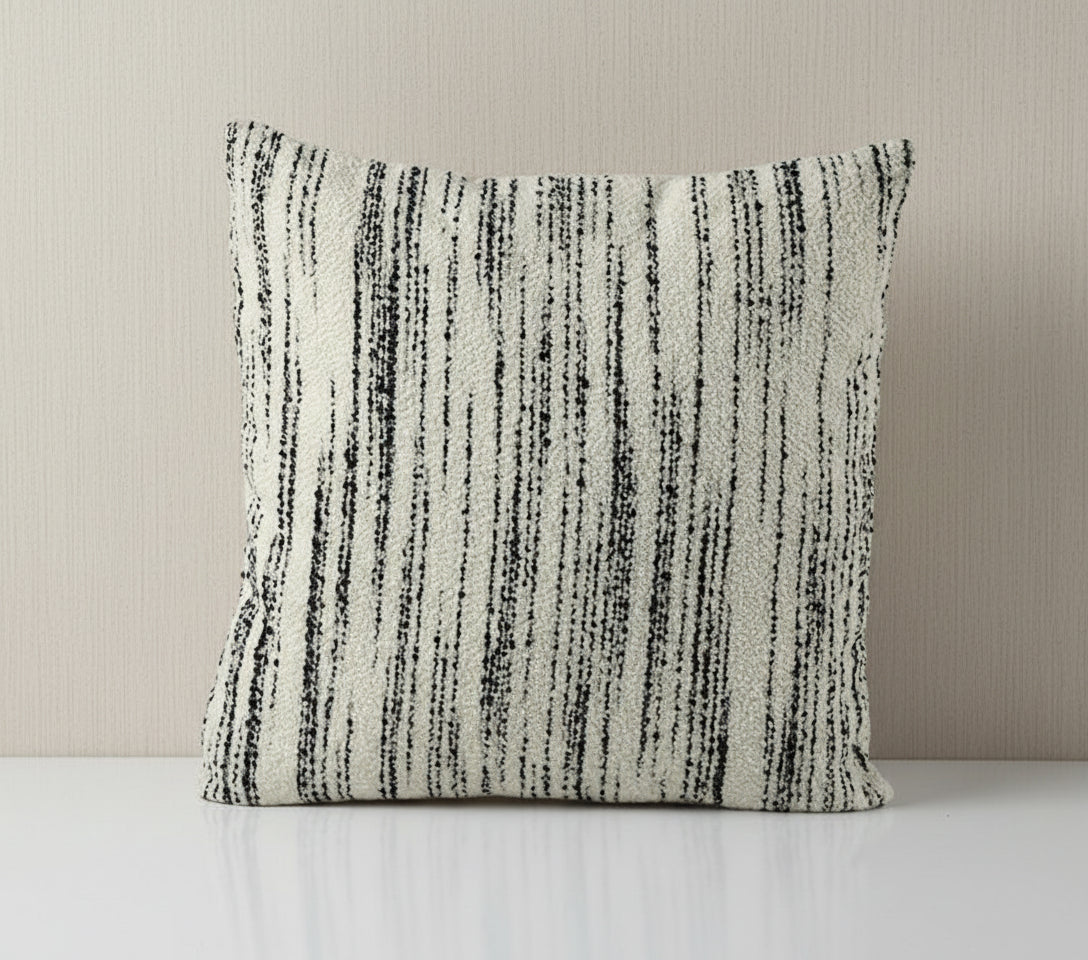 Textured throw pillow with black and white stripes on a white background, featuring the brand Vanik Living 