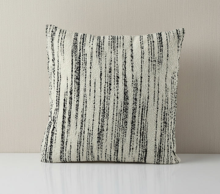 Textured throw pillow with black and white stripes on a white background, featuring the brand Vanik Living 