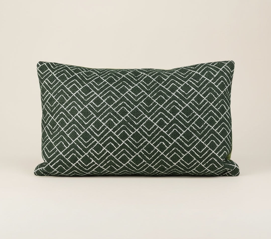 Decorative pillow with geometric pattern on a white background, featuring the brand 'Vanik'.