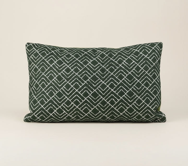 Decorative pillow with geometric pattern on a white background, featuring the brand 'Vanik'.